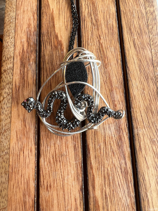 Black druzy petrified wood and snake charm wire-wrapped necklace